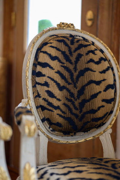 Pair of Custom Painted Louis XVI Antique Carved Fauteuil with Gold Leaf Upholstered in Tiger Print